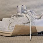 Nike White and Gold Athletic Sneakers Photo 3