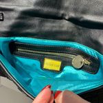 deux luv Leather Woven Handbag with leather/chain strap and blue satin interior. Photo 1