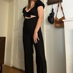 Rewind‎ front tie cut out jumpsuit puff sleeves size small Black Photo 1