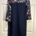 AGB navy dress with sheer floral details at neck and sleeves. Size 10 Photo 0