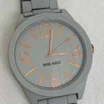 Nine West gray tone 42mm quartz analog gold tone indices size 7” running Photo 2