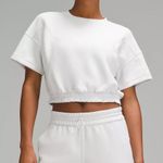 Lululemon Softstreme Gathered T-Shirt  Peach-fuzz soft texture Feels smooth next to skin Four-way stretch Quick-drying Weighty drape Machine washable. Water drops can easily mark this fabric—a simple wash will remove them  ColourLight Vapor Photo 0