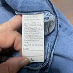 None Lightweight Women’s blue jeans, flared leg with tie details, size large Photo 5