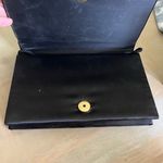 Edgy Black and Gold Skull Clutch Photo 1