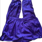 REI purple windbreaker pants that unzip at bottom measurements in pictures Size undefined Photo 1