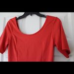 Eyelash Couture Orange U-Back Peplum blouse Photo 1