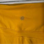 Athleta  Ultimate‎ Stash II Capri Leggings Yellow Size Medium Photo 6