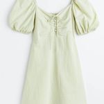 H&M Green dress with puffy sleeves and a tie detail Photo 0