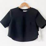Good American Strong Shoulder Scuba Crop Tee in Black Photo 0