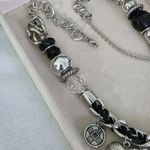 Silver and Black Charm Necklace Mixed Media Photo 1