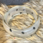 Cute Lucite bracelet, a very light white with black dots.​​ Photo 0
