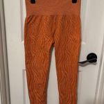 NVGTN Burnt Orange Zebra Seamless Leggings size small Photo 0