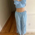 Colsle Stylish blue gingham two-piece set featuring a crop top and wide-leg pants. Photo 1