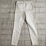 Celebrity Pink Mid Rise Cream Colored Skinny Jeans with Classic Denim Texture Photo 1