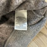 Peloton Gender neutral, full zip sweatshirt with an exaggerated hood, front hand pockets, and rib detail  at sleeve cuffs and bottom band Garment dyed for a worn in feel 100% cotton  logo at left chest  Studios logo at center back Made in the USA No size tag pit to pit measurement is 26,length is 30 Photo 3