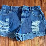 PacSun Medium to dark wash jean shorts with some rips. Photo 0