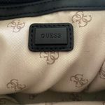 Guess -BLACK BACKPACK The perfect backpack, all black with black hardware, front zip pocket, inside has a zip pocket and 3 open pockets, excellent condition Measures: 10x8 1/2 x 4 inches Photo 12