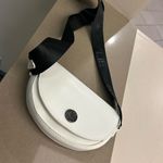 Kendall + Kylie Black and White Crossbody Bag with Semi-Circular Design Photo 3