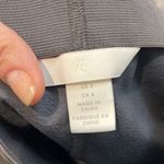 H&M  grey faux leather skinny leg pants size 4. In great condition! Photo 4
