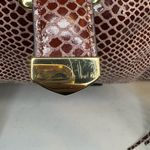 G.I.L.I.Snake Fringe Stirrup Shoulder Red/Brown Patent Suede Bag. Photo 1