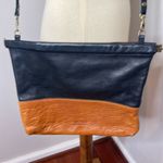 AWL Snap Crossbody Clutch in Black Brown Color Block Leather Photo 1