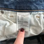 American Eagle  dark wash blue high rise distressed tomgirl button front jeans Photo 7