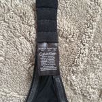 Calvin Klein  strapless bra.  Size 30c. Black. Padded. Non slip edges. Photo 3