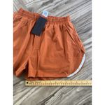 Alphalete  Woman’s Infinity Stride Short W/ Liner - Sour Tangerine, Size Medium Photo 4