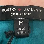 Romeo + Juliet Couture  turquoise ruffled crop top with lace up back / M … Photo 12