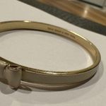 Kate Spade  Signed Bangle Bracelet Bow Tie Creamy White / Gold Tone - 7 3/4 Inch Photo 3