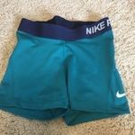 Nike Pro woman’s size XS teal and navy shorts Photo 0