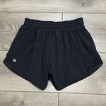 Lululemon Hotty Hot Short 4" Black Running Shorts OVA Logo Size 4 Tall Photo 1