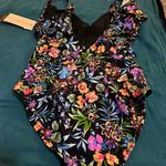 Gottex Dive into elegance with this  one-piece swimsuit, showcasing a vibrant floral pattern in blue and pink hues. Photo 7