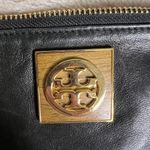 Tory Burch  Black and Gold Clutch with Leather Finish and Zipper Closure Photo 1
