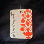 Free People Movement NWT--THE WAY HOME JOGGERS-BLACK-SIZE MEDIUM-MSRP $60 Black joggers, wide smocked waistband, pull on style, front hip pockets, 100% nylon, brand new with tags Measurements: Waist: side to side 15-18 inches Inseam: 28 inches  Photo 9