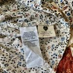 Madewell  white, blue, orange, and brown floral knee length skirt. Size S Photo 5