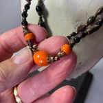 Vintage glass metal brass beaded 21” long necklace . Orange Photo 1