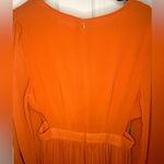 NWT women’s orange long sleeve, open sides dress Photo 1