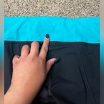 Lululemon  Water Bound Crops Black and Blue Tropics Size 4 Photo 7
