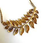 ALDO  gold tone feather leaf pendant necklace Photo 7