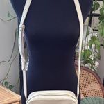 Cuyana Cream Pebbled Leather Tassel Zip Crossbody Camera Bag Photo 0