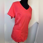Grey's Anatomy V-Neck Short Sleeve scrub Top in Coral/orangish. Size Medium. Photo 1