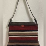 The Sak  soft knit multi colored striped crossbody purse.  Has a 70s/80s vibe Photo 0