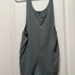 Entro Green green romper with front pockets! Photo 1