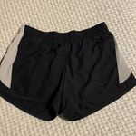 Nike  womens dri fit black and white running shorts size S Photo 0