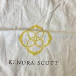Kendra Scott Cream Dust Bag with Yellow Tassels Photo 2