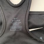 Nike Women's Black Sports Bra Sleek black design with white logo. . Photo 2
