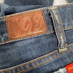 Level 99 flared leg darker denim jeans with rhinestone belt loops. Size 28 Photo 14