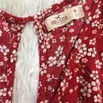 Hollister Women’s long sleeve romper shorts in all over floral red size Medium Photo 6