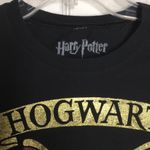 FINAL MARKDOWN Juniors’ Harry Potter Hogwarts Crest SS Tee (L) Size undefined Photo 2